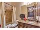 Traditional bathroom features a shower-tub combo and vanity with granite counter at 4431 E Gemini Pl, Chandler, AZ 85249