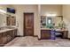 Spacious bathroom featuring dual vanities, granite countertops, and custom cabinetry at 4431 E Gemini Pl, Chandler, AZ 85249