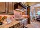 Gourmet kitchen features granite countertops, custom cabinets, and stainless steel appliances at 4431 E Gemini Pl, Chandler, AZ 85249