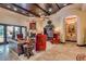 Elegant living room with fireplace, decorative ceiling, and access to outdoor patio at 4431 E Gemini Pl, Chandler, AZ 85249