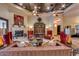 Comfortable living room with fireplace, ceiling fan, and decorative accents at 4431 E Gemini Pl, Chandler, AZ 85249