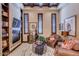 Cozy living room featuring a fireplace, built-in shelving, and comfortable seating at 4431 E Gemini Pl, Chandler, AZ 85249