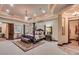 Main bedroom showcasing a tray ceiling, four-poster bed, and en-suite bathroom access at 4431 E Gemini Pl, Chandler, AZ 85249