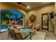 Inviting covered patio with comfortable seating area and view of the pool and landscaped backyard at 4431 E Gemini Pl, Chandler, AZ 85249
