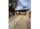 Outdoor picnic area with sheltered tables, landscaping, and gravel flooring at 4431 E Gemini Pl, Chandler, AZ 85249
