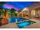 Beautiful backyard pool and spa area with travertine decking, seating and covered patio at 4431 E Gemini Pl, Chandler, AZ 85249
