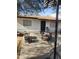 Outdoor patio with a metal fire pit, chairs, and a basketball hoop, perfect for entertaining at 4610 W Indianola Ave, Phoenix, AZ 85031