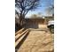 Backyard with gravel, a wooden fence, and a portion of the house at 4610 W Indianola Ave, Phoenix, AZ 85031