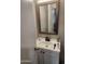 Clean bathroom with a vanity, a mirror, and a black faucet at 4610 W Indianola Ave, Phoenix, AZ 85031