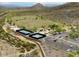 Aerial view of the park with tennis courts, soccer field, playground, parking lot and desert landscape at 4750 W Saddlehorn Rd, Phoenix, AZ 85083