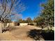 Large backyard featuring desert landscaping, mature trees and a privacy fence at 4750 W Saddlehorn Rd, Phoenix, AZ 85083
