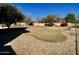 Generous backyard space featuring desert landscaping with a neatly manicured lawn at 4750 W Saddlehorn Rd, Phoenix, AZ 85083