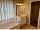 Bathroom featuring a bathtub, shower, and a vanity with storage at 4750 W Saddlehorn Rd, Phoenix, AZ 85083