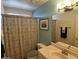 Bathroom with decorative shower curtain, toilet, and a mirror over the sink at 4750 W Saddlehorn Rd, Phoenix, AZ 85083