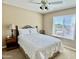 Cozy bedroom with neutral tones, a ceiling fan and a comfortable queen-sized bed at 4750 W Saddlehorn Rd, Phoenix, AZ 85083