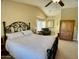 Spacious bedroom with a ceiling fan, closet, sitting area, and an adjacent bathroom at 4750 W Saddlehorn Rd, Phoenix, AZ 85083