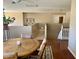 Bright dining area with wood table, hardwood floors, view of the staircase, and neutral paint at 4750 W Saddlehorn Rd, Phoenix, AZ 85083