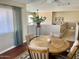 Dining area with a wooden table, chairs, and views of the second-floor loft at 4750 W Saddlehorn Rd, Phoenix, AZ 85083