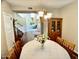 Traditional dining room features hardwood floors, classic chandelier, and a vintage china cabinet at 4750 W Saddlehorn Rd, Phoenix, AZ 85083