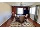 Dining room features a wooden table set, hardwood flooring, and a large area rug at 4750 W Saddlehorn Rd, Phoenix, AZ 85083