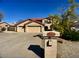 Wide driveway and a three-car garage offering ample parking for residents and guests at 4750 W Saddlehorn Rd, Phoenix, AZ 85083