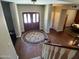 Elegant foyer with hardwood floors, decorative rug, and natural light creating a welcoming entrance at 4750 W Saddlehorn Rd, Phoenix, AZ 85083