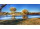Beautiful view of golf course with ponds, trees, bridge, and manicured green at The 500 Club at 4750 W Saddlehorn Rd, Phoenix, AZ 85083