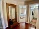 Hallway with doorway to main bedroom featuring a ceiling fan and bathroom with walk-in shower at 4750 W Saddlehorn Rd, Phoenix, AZ 85083