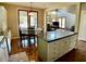 Open concept kitchen with an island, granite countertops, and views into the adjacent living room at 4750 W Saddlehorn Rd, Phoenix, AZ 85083