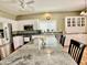 Bright kitchen featuring white cabinets, stainless steel appliances, granite countertops and center island at 4750 W Saddlehorn Rd, Phoenix, AZ 85083