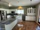 Bright kitchen features white cabinetry, stainless appliances, and a granite-topped island at 4750 W Saddlehorn Rd, Phoenix, AZ 85083