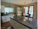 Spacious kitchen with granite counters, white cabinets, and backyard access at 4750 W Saddlehorn Rd, Phoenix, AZ 85083