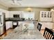 Bright kitchen featuring white cabinets, stainless steel appliances, granite countertops and center island at 4750 W Saddlehorn Rd, Phoenix, AZ 85083
