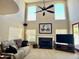 Bright living room featuring high ceilings, fireplace, and comfortable seating at 4750 W Saddlehorn Rd, Phoenix, AZ 85083