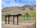 Scenic view of the park with a shelter, sports field, mountain backdrop, and clear blue sky at 4750 W Saddlehorn Rd, Phoenix, AZ 85083
