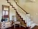 Classic staircase features wood trim and white spindles, adding elegance to the foyer at 4750 W Saddlehorn Rd, Phoenix, AZ 85083