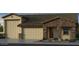 Charming home featuring a three-car garage, a stone facade, and a covered entryway at 5445 N 178Th Ave, Litchfield Park, AZ 85340