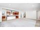 Bright, open-concept living room with view of the kitchen and a staircase to the second floor at 5544 W Saint Moritz Ln, Glendale, AZ 85306