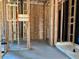 Framing of a bathroom with the beginnings of the shower being installed and plumbing access points at 5610 W Olney Ave, Laveen, AZ 85339
