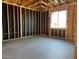 Bedroom framing with visible wall insulation, window placement, and the concrete flooring base at 5610 W Olney Ave, Laveen, AZ 85339