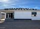 Exterior framing of a new home construction with the back patio, window framing, and roofing materials at 5610 W Olney Ave, Laveen, AZ 85339
