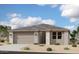 Charming single-story home features a two-car garage, neutral palette, and low-maintenance landscaping at 5610 W Olney Ave, Laveen, AZ 85339