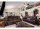Spacious living room with high ceilings, wrought iron balcony, and comfortable seating at 5622 E Gelding Dr, Scottsdale, AZ 85254
