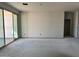 Spacious living room featuring sliding glass doors and ample natural light at 5631 W Summerside Rd, Laveen, AZ 85339