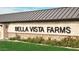 Elegant Bella Vista Farms signage surrounded by manicured landscaping at 5631 W Summerside Rd, Laveen, AZ 85339