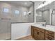 Bright bathroom showcasing a modern shower, vanity, and minimalist design at 5733 W Saint Moritz Ln, Glendale, AZ 85306