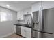 Updated kitchen features stainless steel appliances, including refrigerator and dishwasher at 6125 E Indian School Rd # 131, Scottsdale, AZ 85251
