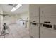 Bright laundry room with multiple washers and dryers, providing convenience for residents at 6125 E Indian School Rd # 131, Scottsdale, AZ 85251