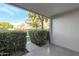 View from a private patio overlooking lush landscaping and blue skies, offering a tranquil outdoor space at 6125 E Indian School Rd # 131, Scottsdale, AZ 85251
