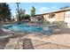 Sparkling community pool with lounge chairs, offering a relaxing oasis for residents at 6125 E Indian School Rd # 131, Scottsdale, AZ 85251